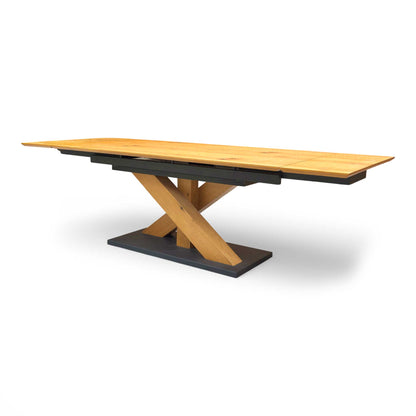Side profile of the Aydin dining table, showcasing the clean lines and sophisticated silhouette of the solid oak construction.