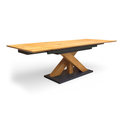 Full view of the 'Aydin' 180cm extending dining table in solid oak, featuring a natural wood grain finish and a sturdy, modern base.