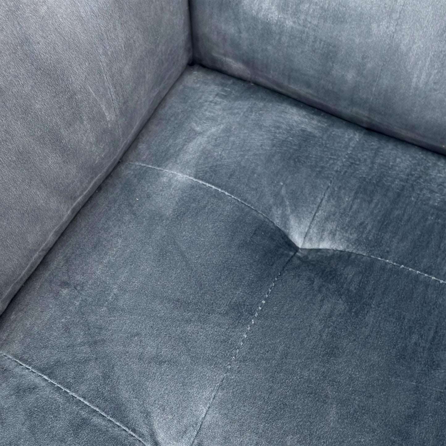 Close-up shot of the Heritage Granite Grey velvet on the ‘Rene’ sofa, showcasing the dense plush pile, premium tailored seams, and rich multi-tonal light-catching texture.