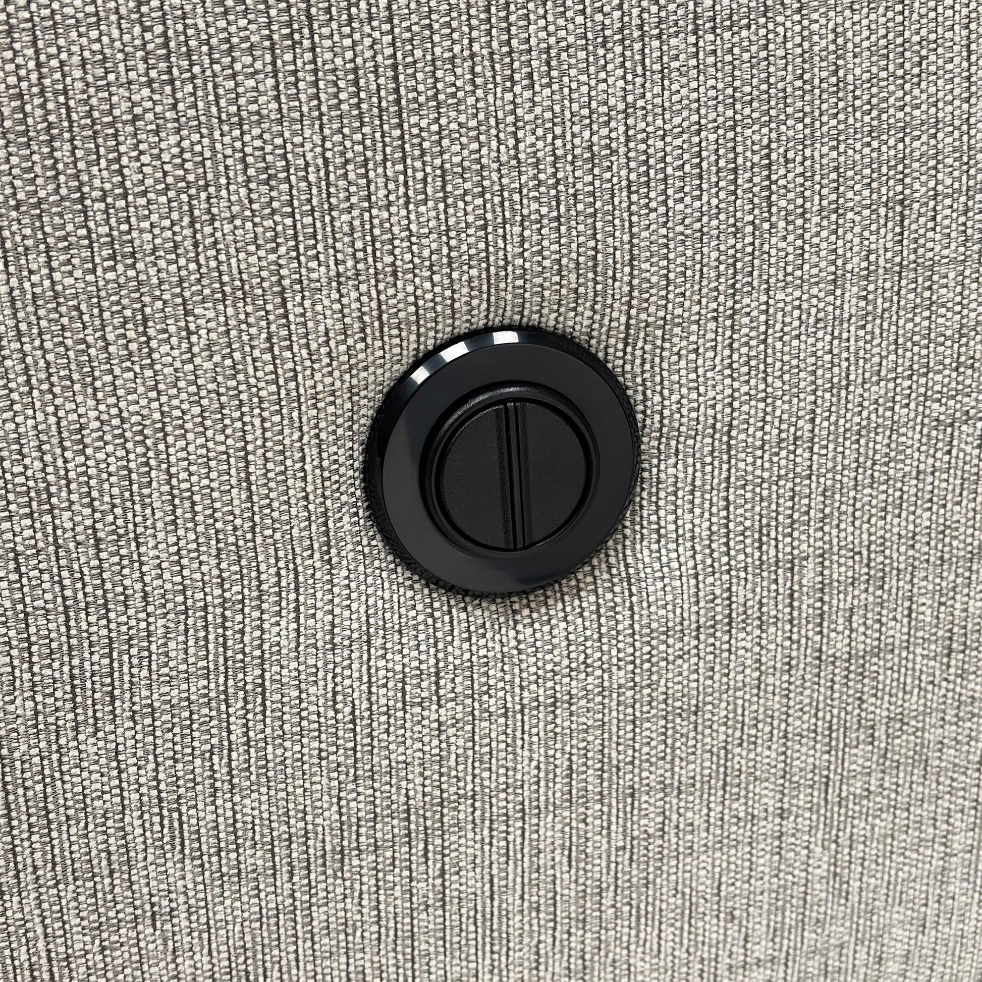 Close-up of the Bariba Grey woven fabric and chrome insert, highlighting the premium textured finish and high-quality craftsmanship of the upholstery.