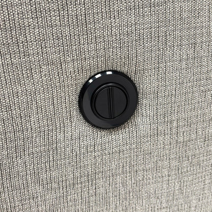 Close-up of the Bariba Grey woven fabric and chrome insert, highlighting the premium textured finish and high-quality craftsmanship of the upholstery.