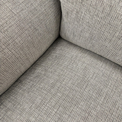 Close-up of the Bariba Grey woven fabric and chrome insert, highlighting the premium textured finish and high-quality craftsmanship of the upholstery.