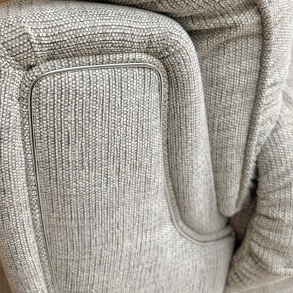 Close-up of the Bariba Grey woven fabric and chrome insert, highlighting the premium textured finish and high-quality craftsmanship of the upholstery.