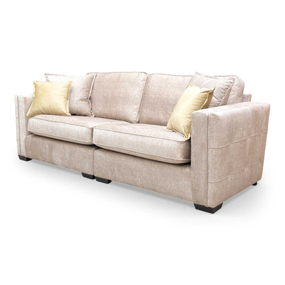 Side view of the Chelsea sofa showcasing the spacious seating area and deep beige upholstery.