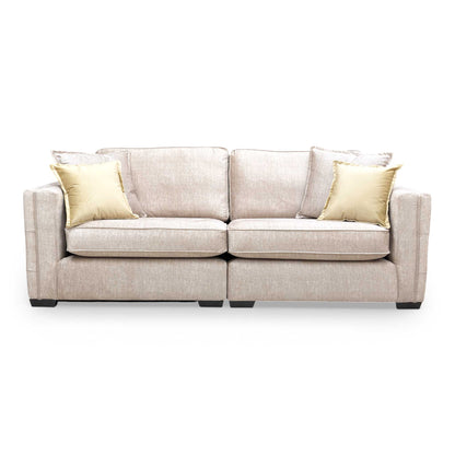 Front view of the Chelsea 4 seater split frame sofa in beige Vogue velvet with a formal back design.