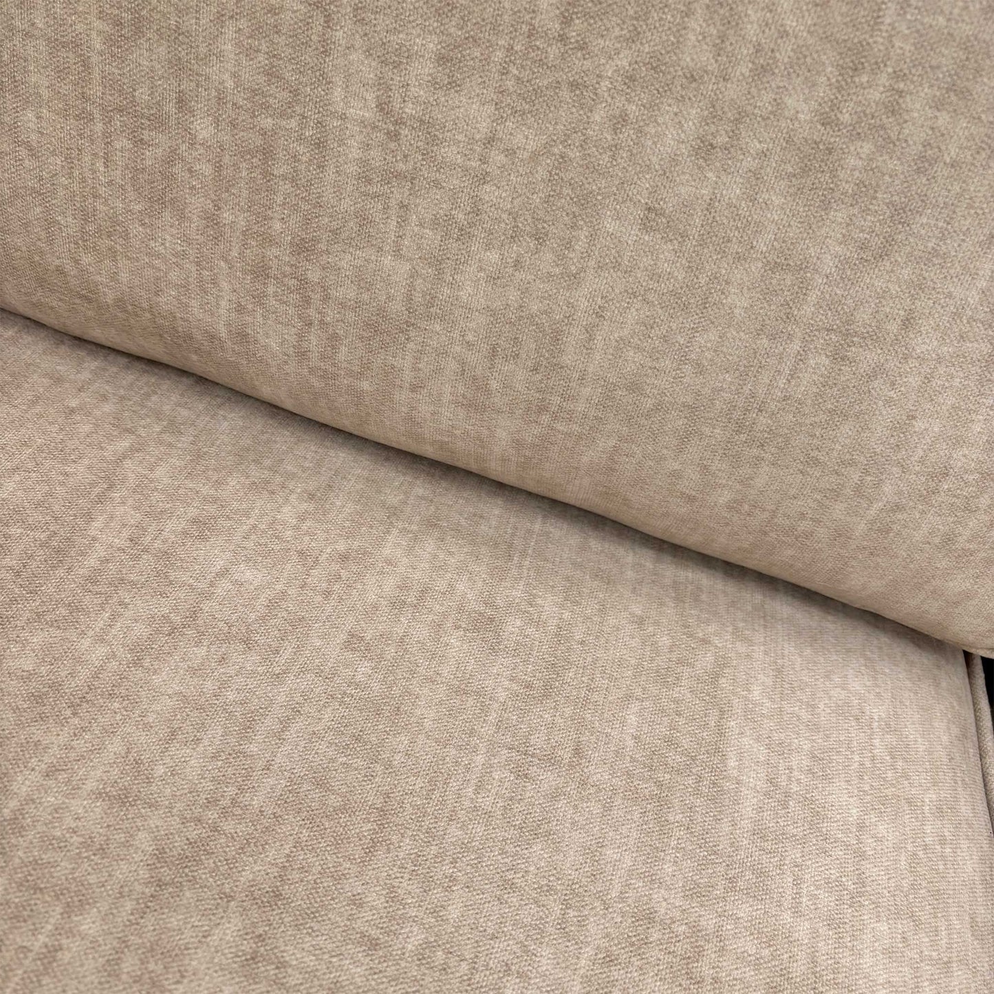 Close-up of the luxurious beige Vogue velvet fabric and detailed stitching on the Chelsea sofa frame.