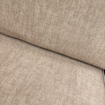 Close-up of the luxurious beige Vogue velvet fabric and detailed stitching on the Chelsea sofa frame.