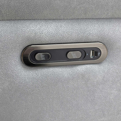 Close-up of the integrated power recliner controls and USB charging port, designed for convenient device charging while relaxing.