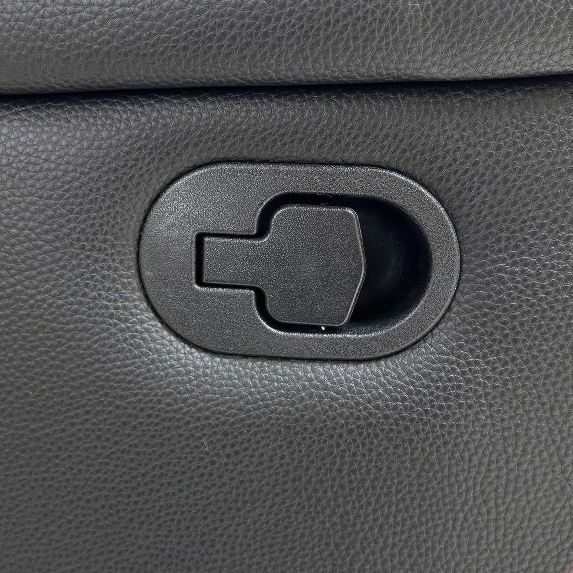 Close-up of the black faux leather upholstery, highlighting the durable, easy-clean finish and quality stitching.