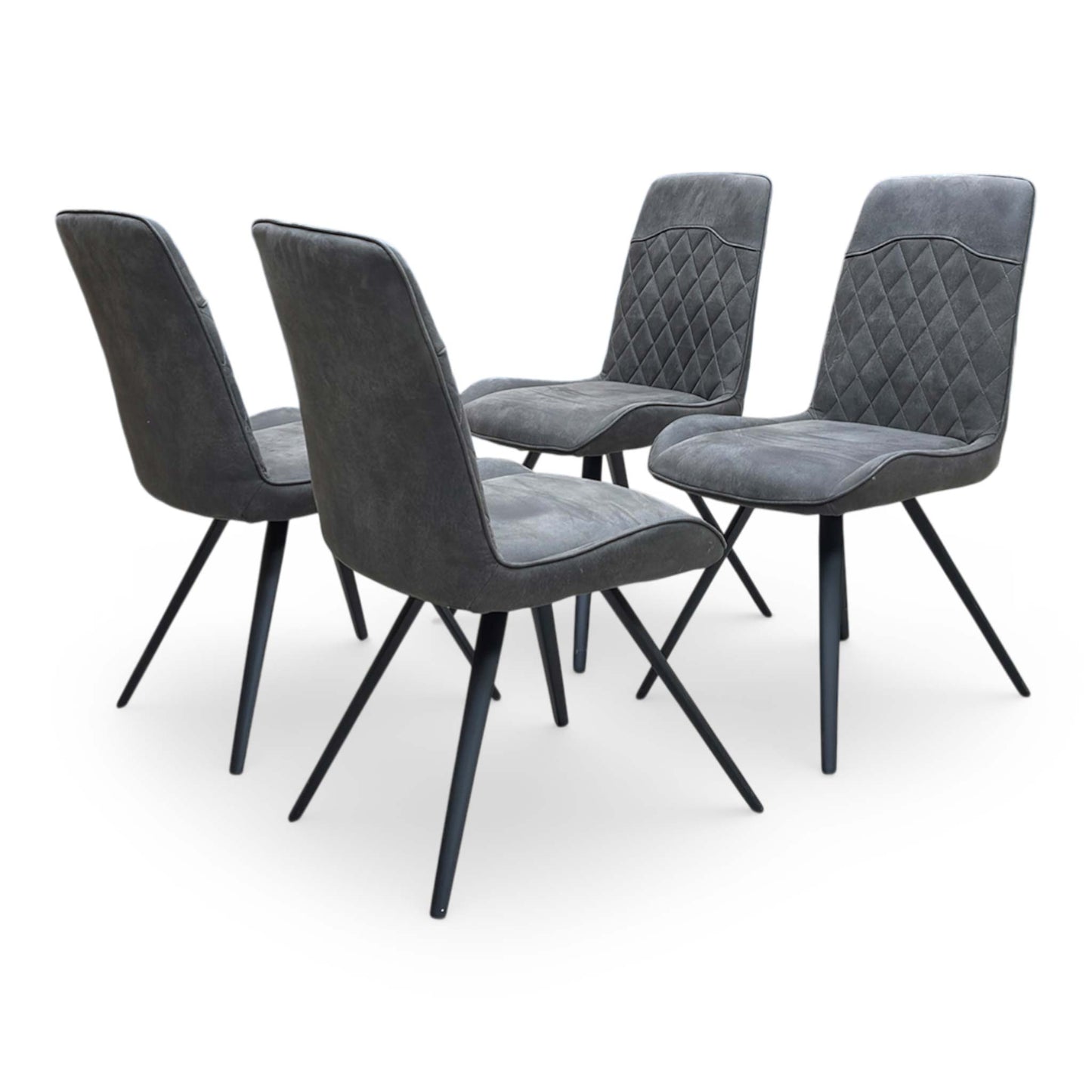 Full view of the four Warrior dining chairs upholstered in grey fabric with quilted-effect stitching and slender angled metal legs.