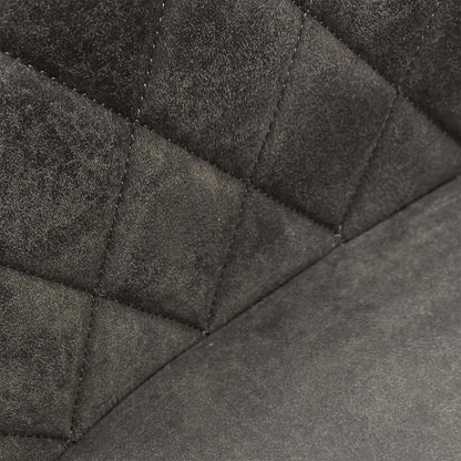 Close-up of the grey fabric upholstery on the Warrior chair, showcasing the intricate quilted-effect decorative stitching.