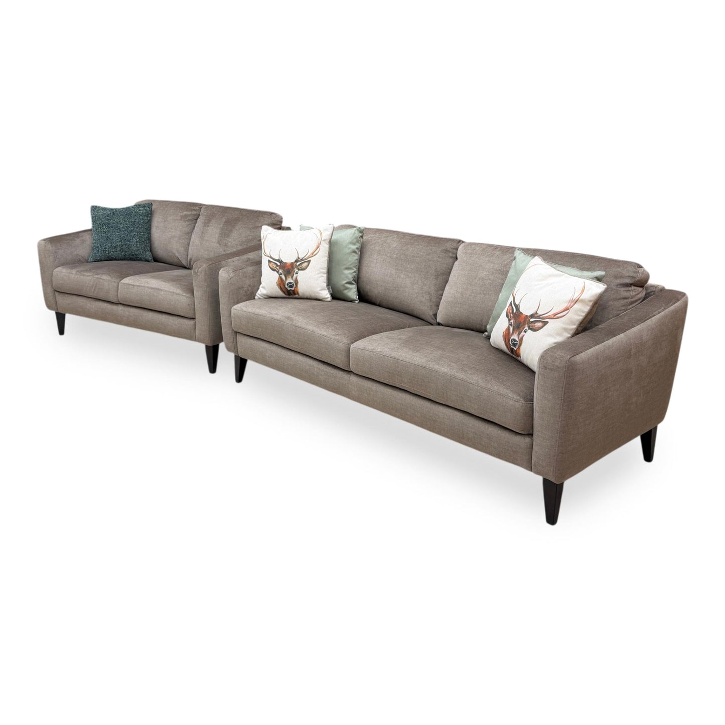 Side view of the Oslo Vogue velvet sofa frame, illustrating the generous seating depth, angled backrest support, and sturdy modern base feet.