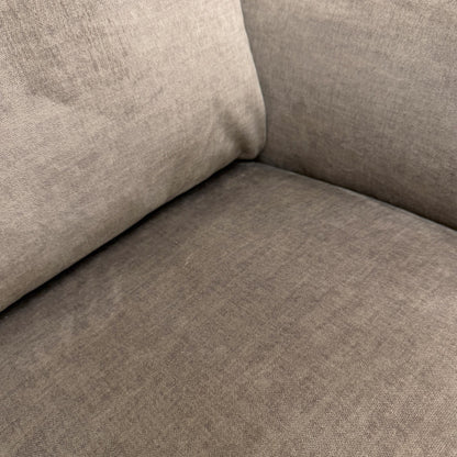 Close up view of the Oslo Vogue stone velvet 3-seater sofa, demonstrating a pristine, fully upholstered back panel suitable for central open-plan placement.