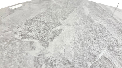 Detailed close-up of the real marble tabletop, showing the natural grey veining and smooth, polished surface.