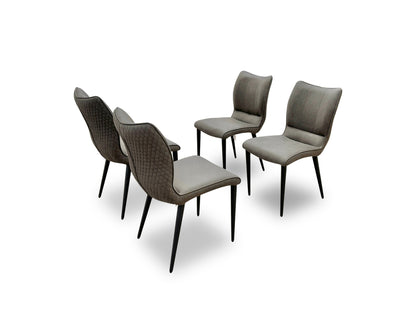 Rear view of the Murcia dining chair showcasing the uniform antiqued grey fabric coverage and the sleek, tapered matt black metal legs.