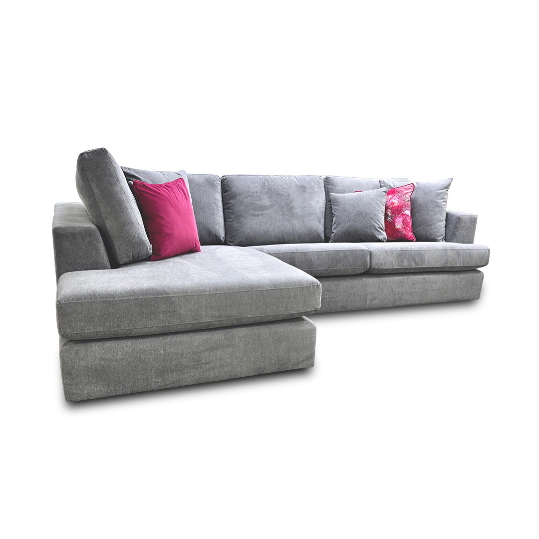 Detail view of the sofa's corner section and cushions, showcasing the plush comfort and modern aesthetic of the design.