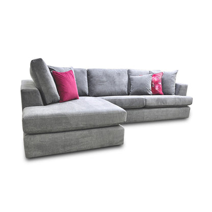 Detail view of the sofa's corner section and cushions, showcasing the plush comfort and modern aesthetic of the design.