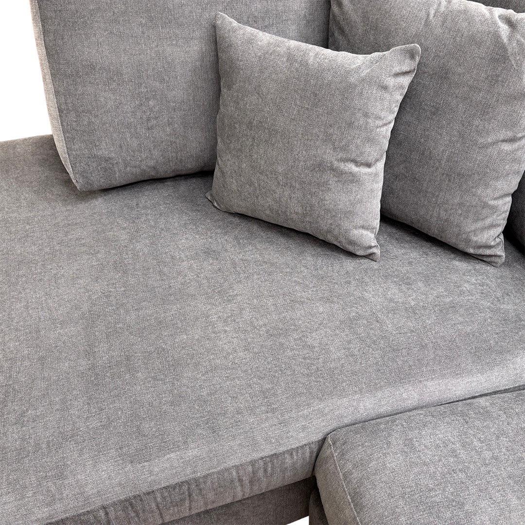 Close-up of the durable Gracelands fabric in graphite, illustrating the high-quality texture and expert stitching of the upholstery.