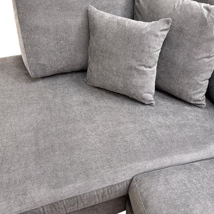 Close-up of the durable Gracelands fabric in graphite, illustrating the high-quality texture and expert stitching of the upholstery.