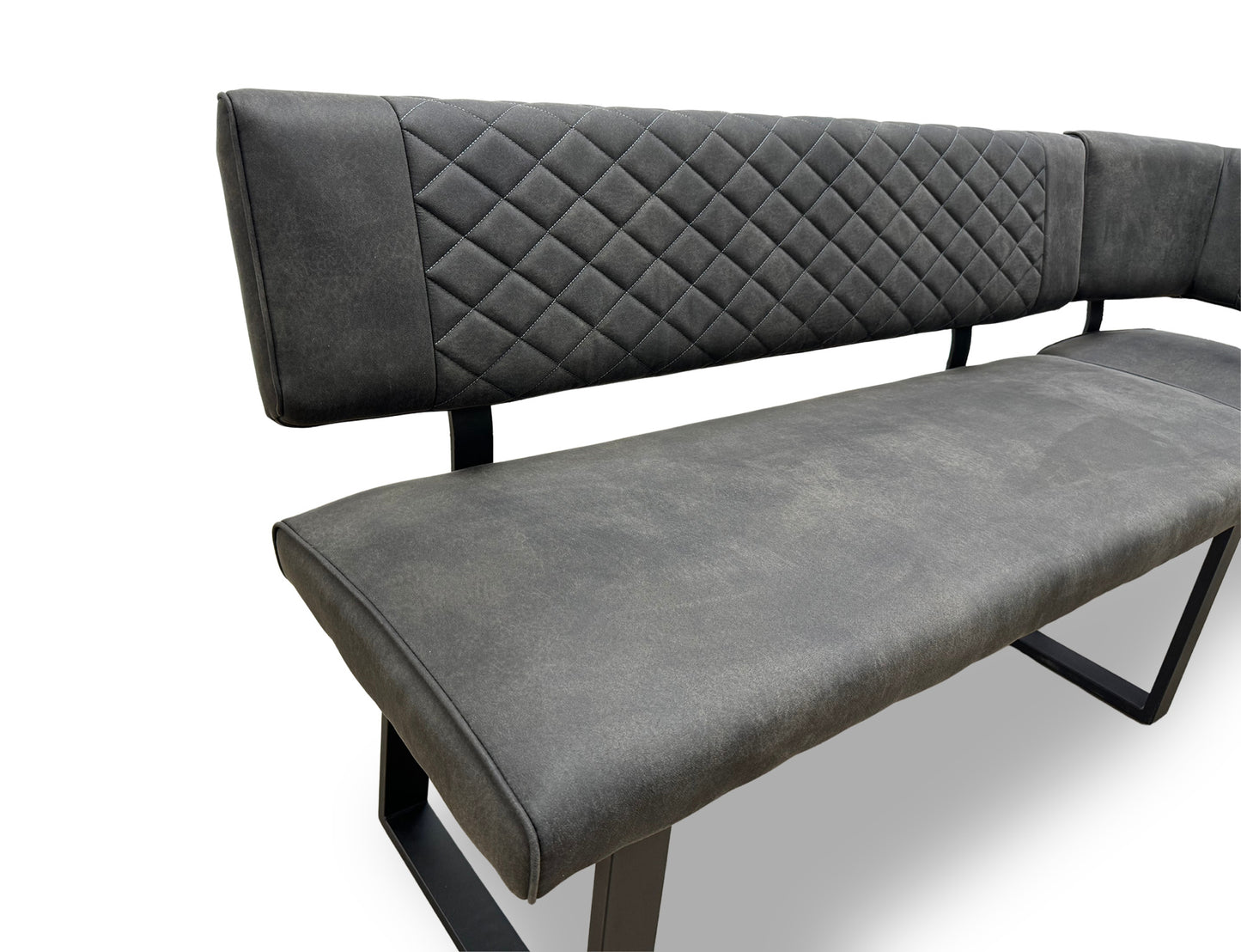 Close-up of the grey fabric upholstery on the ‘Warrior’ bench, emphasizing the quilted-effect stitching.