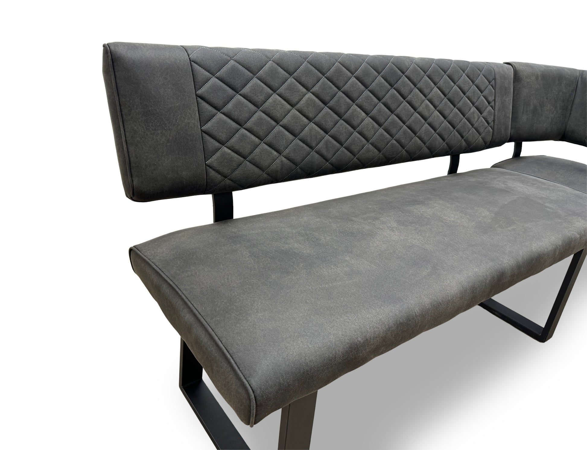 Close-up of the grey fabric upholstery on the ‘Warrior’ bench, emphasizing the quilted-effect stitching.