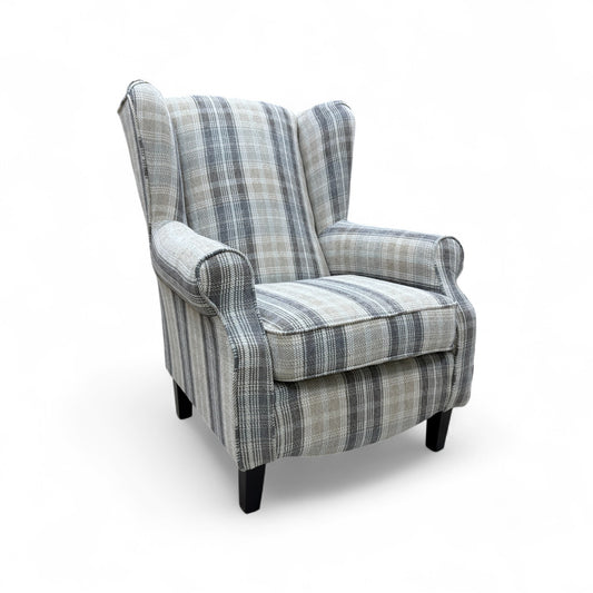 Angled front view of the entire 'Shirley' accent chair, showing the scroll arm design and the Taupe and Grey checkered pattern.