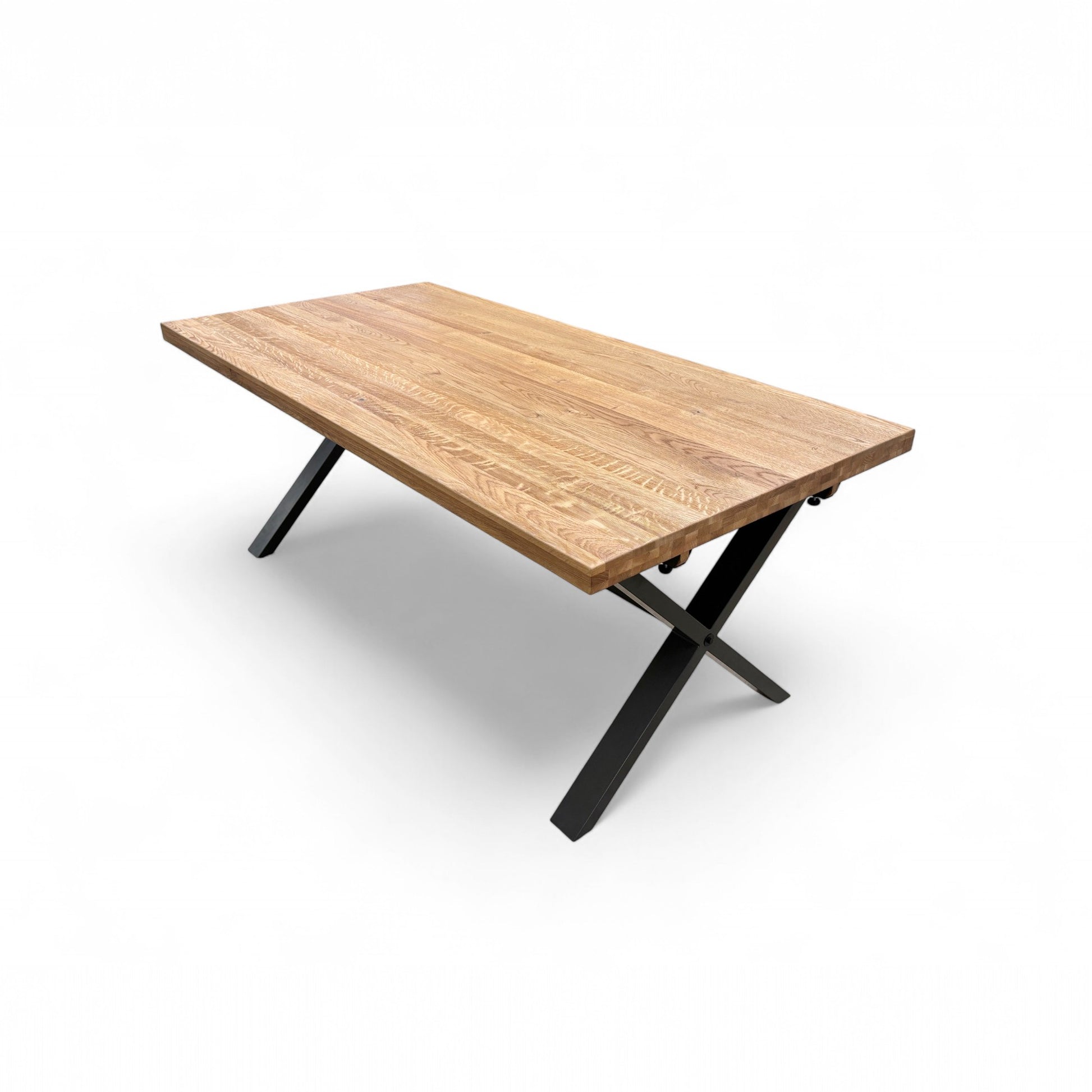 Detail shot of the thickness and edge profile of the solid oak top, showing the quality and substantial feel of the fixed dining table.