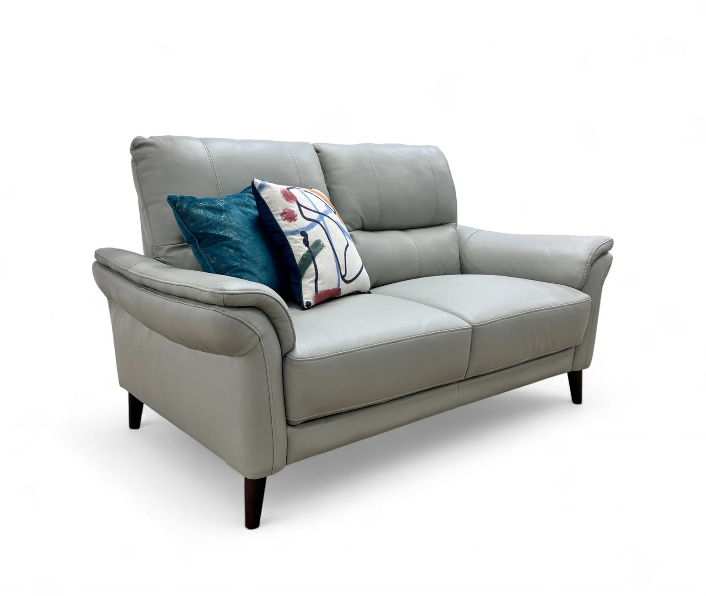 Full, angled front view of the 'Winner' Oslo 2 Seater Sofa, showcasing its light grey leather upholstery, rolled arms, and pocket-sprung seat cushions.