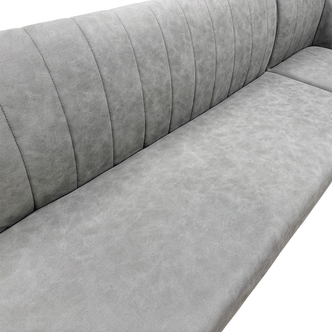 Close-up detail of the grey faux leather upholstery on the 'Grigio' dining bench, showing the subtle stitching and material texture.