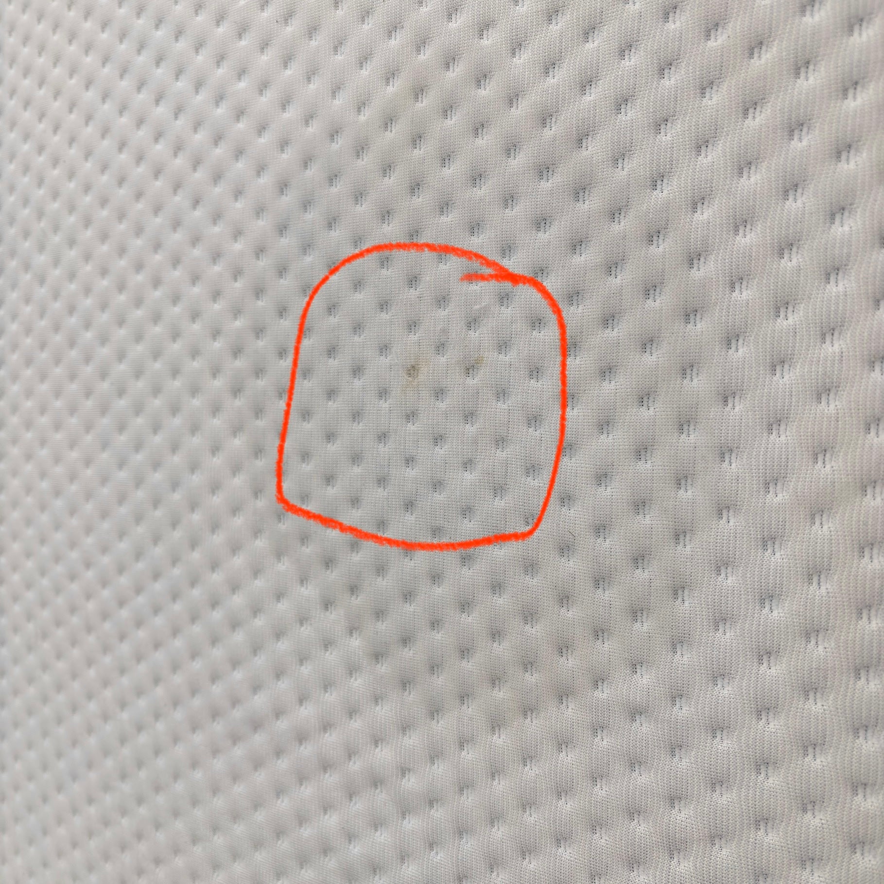 Emma Mattress Original Super King - close-up of white cover fabric with a small mark circled to highlight material detail