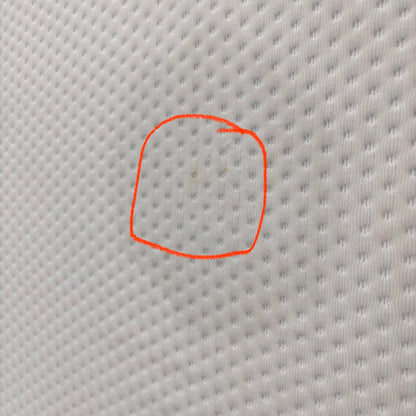 Emma Mattress Original Super King - close-up of white cover fabric with a small mark circled to highlight material detail