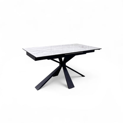 Detail view of the edge of the Crete dining table, showing the ceramic top's lamination to the tempered glass.