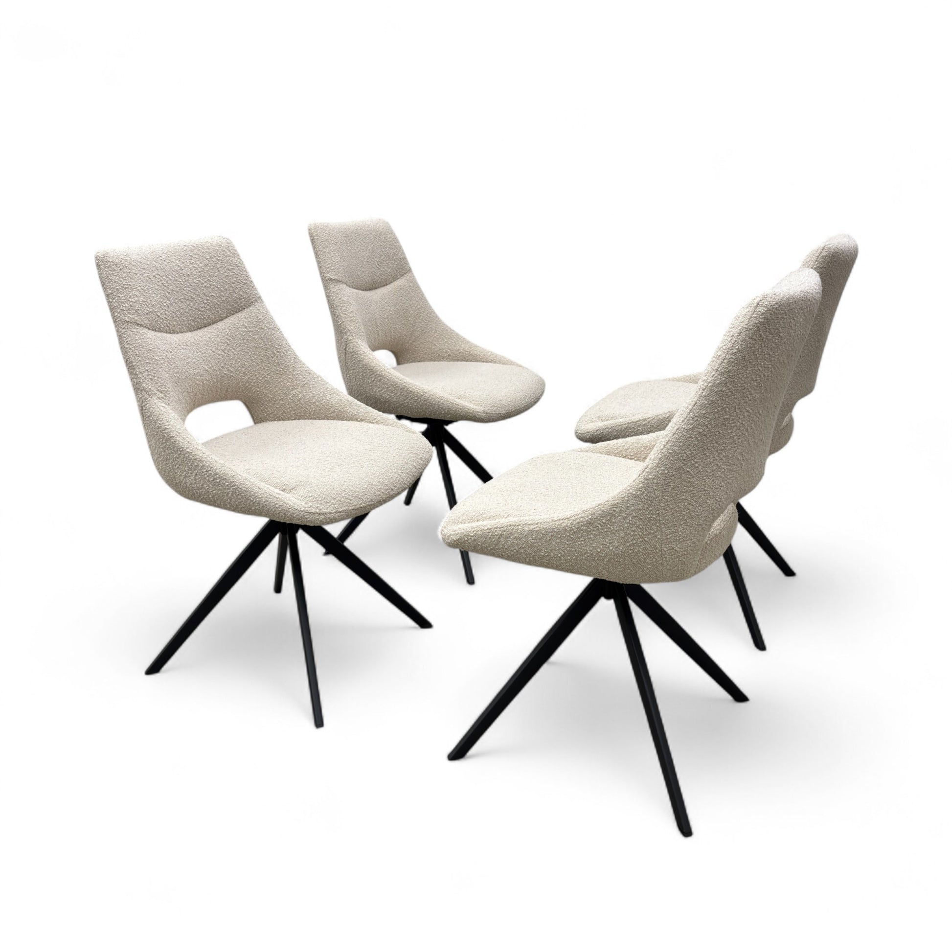 Full View four 'Barefoot' swivel dining chairs upholstered in luxurious cream boucle fabric.