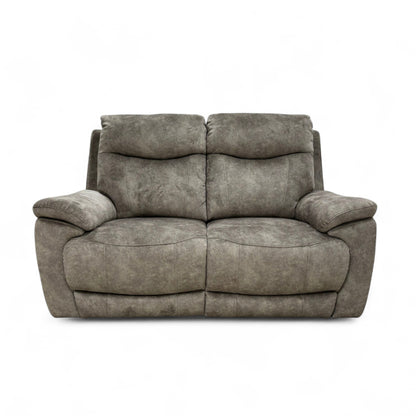 The Charcoal Grey Velvet Sloane Sofa with the power recliner footrest fully extended, showing the comfortable lounging position.