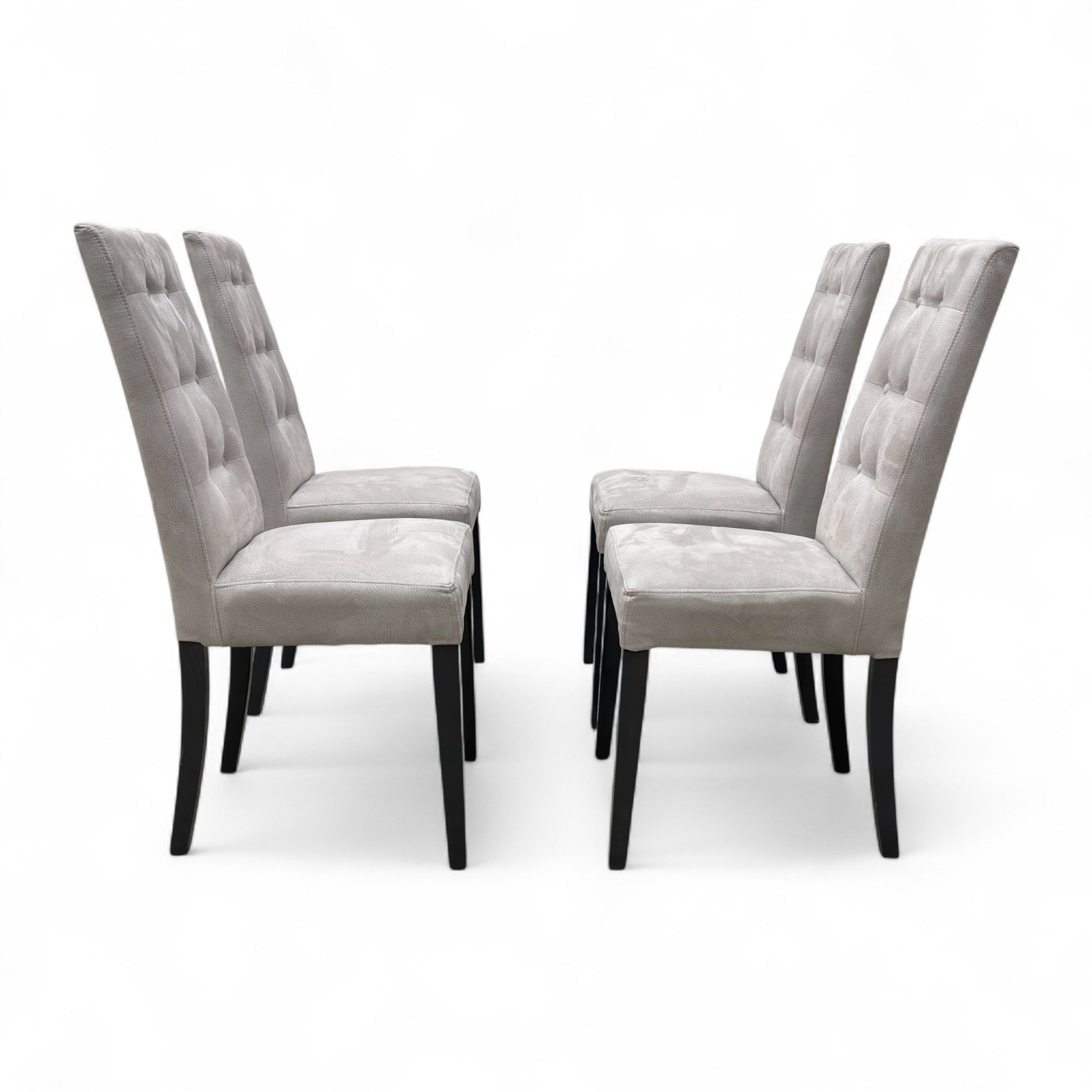 Full front view of a single 'Mia' high back dining chair in silver suede fabric, featuring classic button-tufting on the backrest.