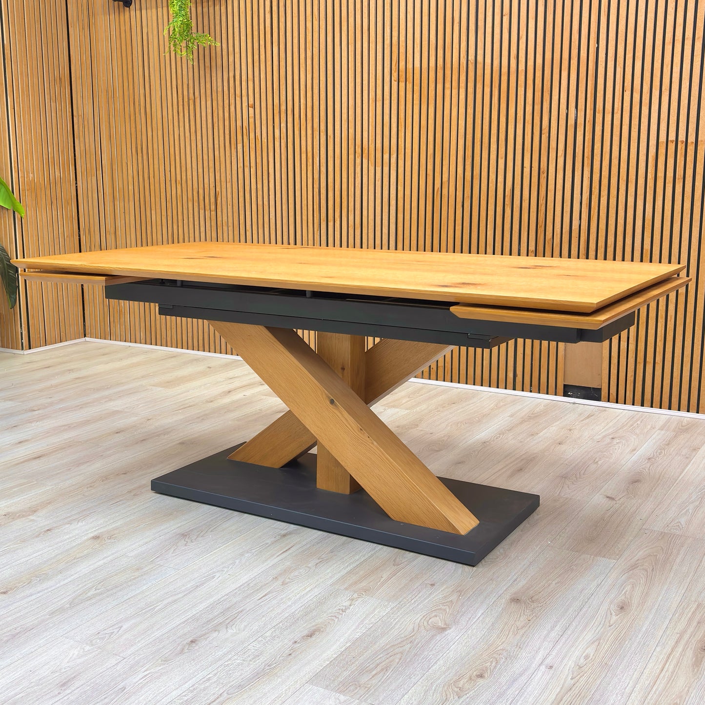 Lifestyle view of the Aydin table in a dining room setting, showcasing the authentic grain patterns and spacious surface for family entertaining.