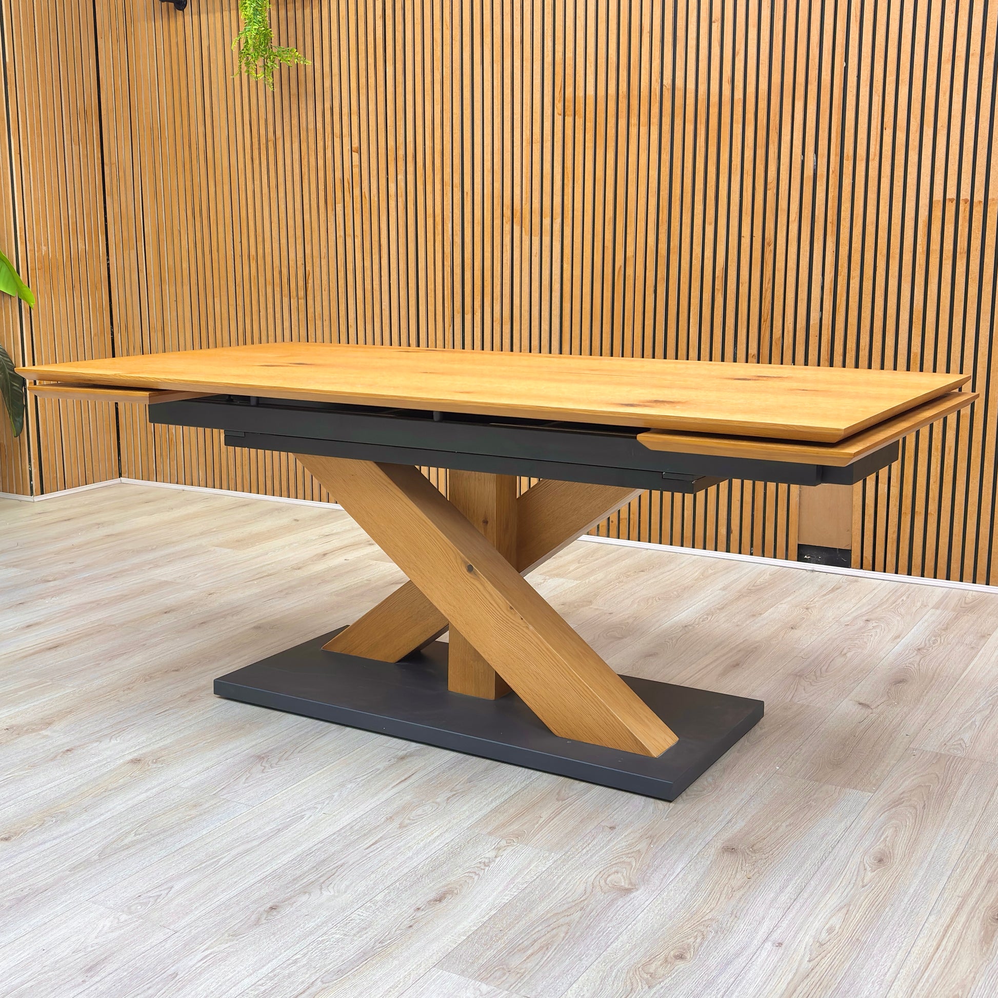 Lifestyle view of the Aydin table in a dining room setting, showcasing the authentic grain patterns and spacious surface for family entertaining.