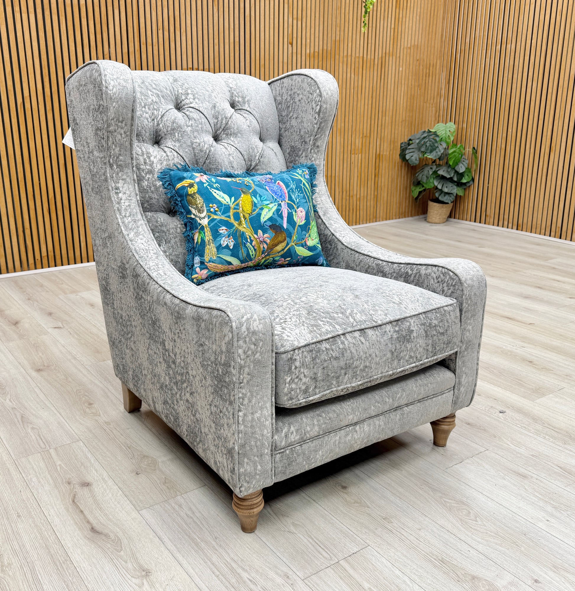 Side profile of the Blenheim chair, emphasizing the supportive winged backrest and comfortable deep seat cushioning.