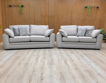 Lifestyle view of the Chalfont 3-seater sofa in Novak Grey fabric, showcasing the deep-filled back cushions and sleek armrests.