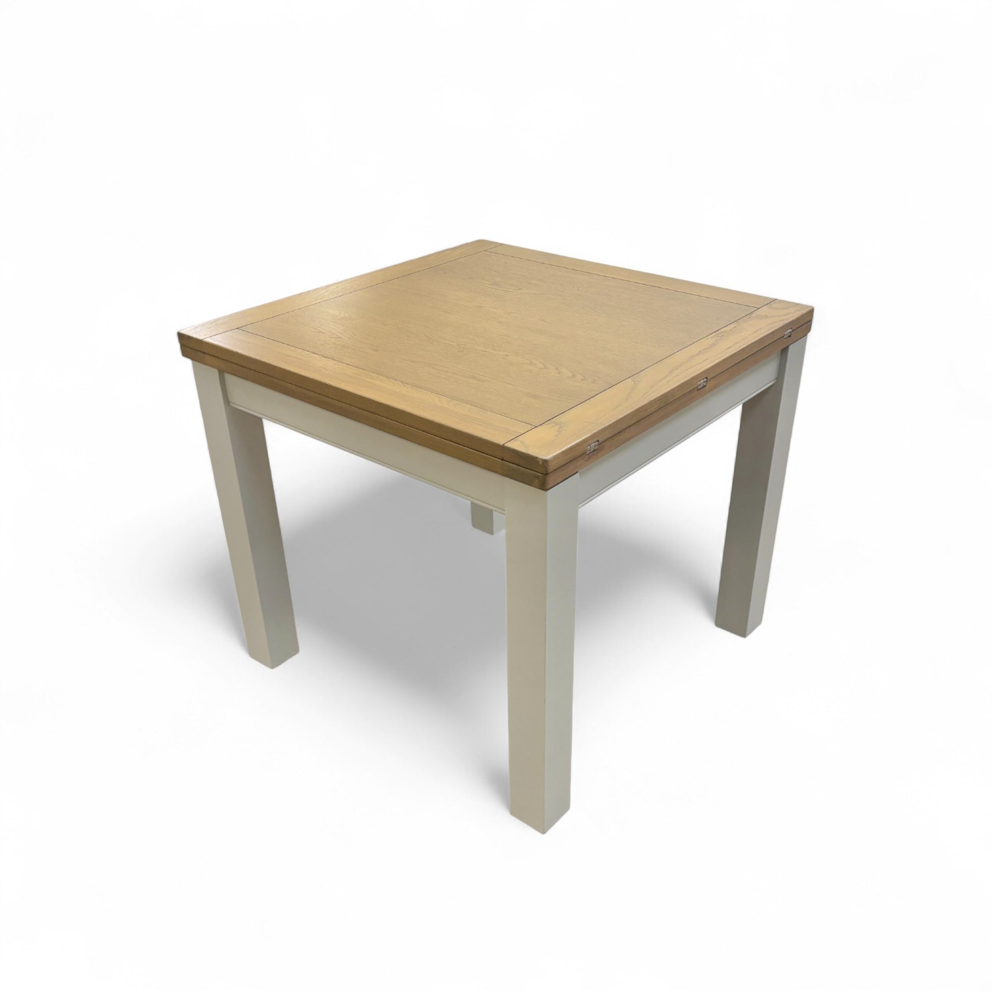 Detailed close-up of one of the stylish grey-painted legs of the 'Hamilton' dining table.