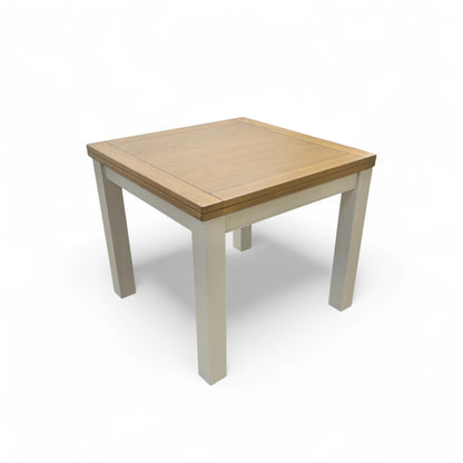 Angled view of the 'Hamilton' Solid American Oak Flip-Top Extending Dining Table, showing its full 180 cm length and chunky, modern country style.