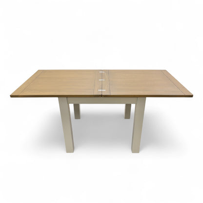 Image of the 'Hamilton' dining table during the process of converting from the closed square to the fully extended rectangular position.