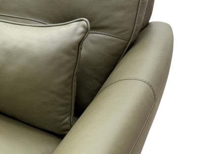 Close-up detail of the khaki green leather upholstery on the armrest and side of the 'Ava' chair, showing the texture and stitching.