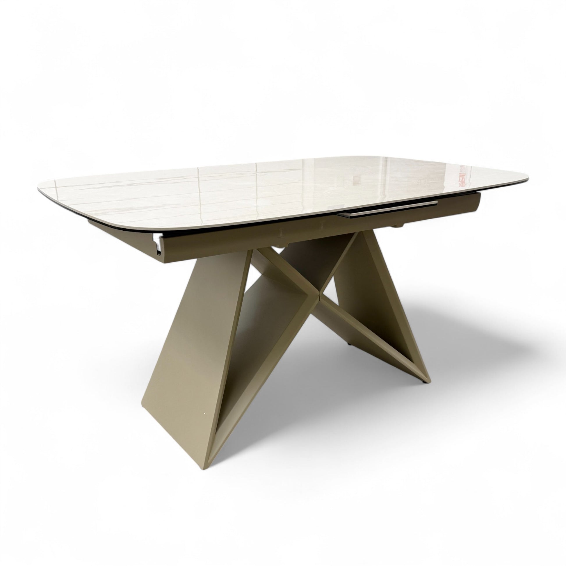 Full view of the Furniture Village 'Mirage' small 140cm dining table, featuring a high-gloss ceramic top with a travertine marble-inspired finish.