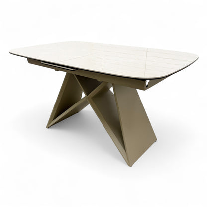 Shot showing the table partially extended, highlighting the extension leaf mechanism.