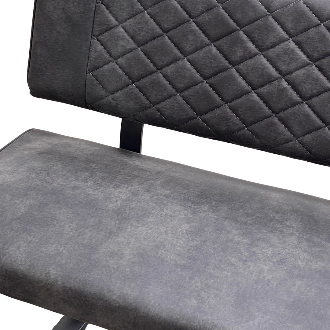 Close-up of the grey fabric upholstery on the backrest of the 'Warrior' dining bench, showing the quilted stitching pattern.