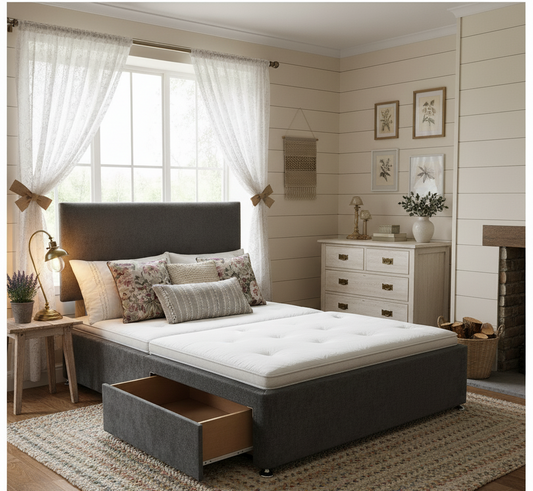 Gray upholstered bed with storage drawers in a bedroom setting.