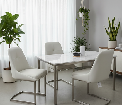 Modern dining room with a marble table and white chairs, featuring plants and neutral decor.