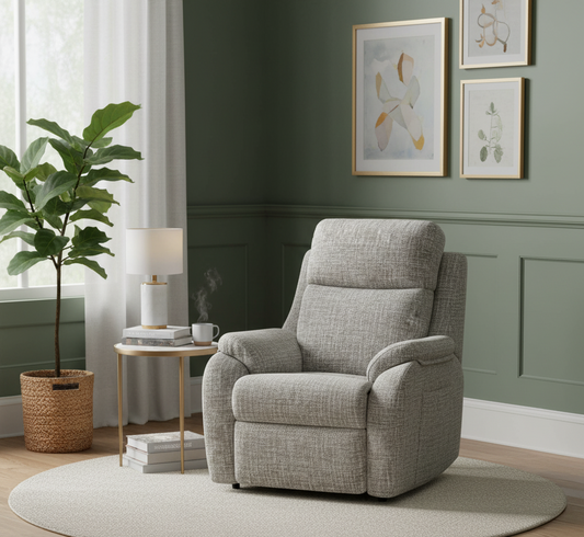 Gray recliner chair in a living room with green walls, a plant, and side table.