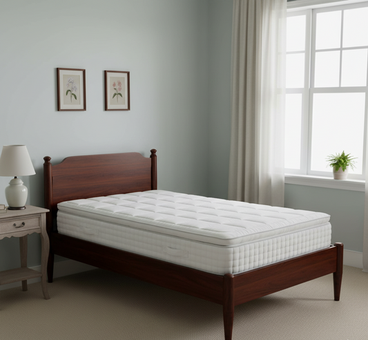 White mattress on a wooden bed frame in a bedroom setting.